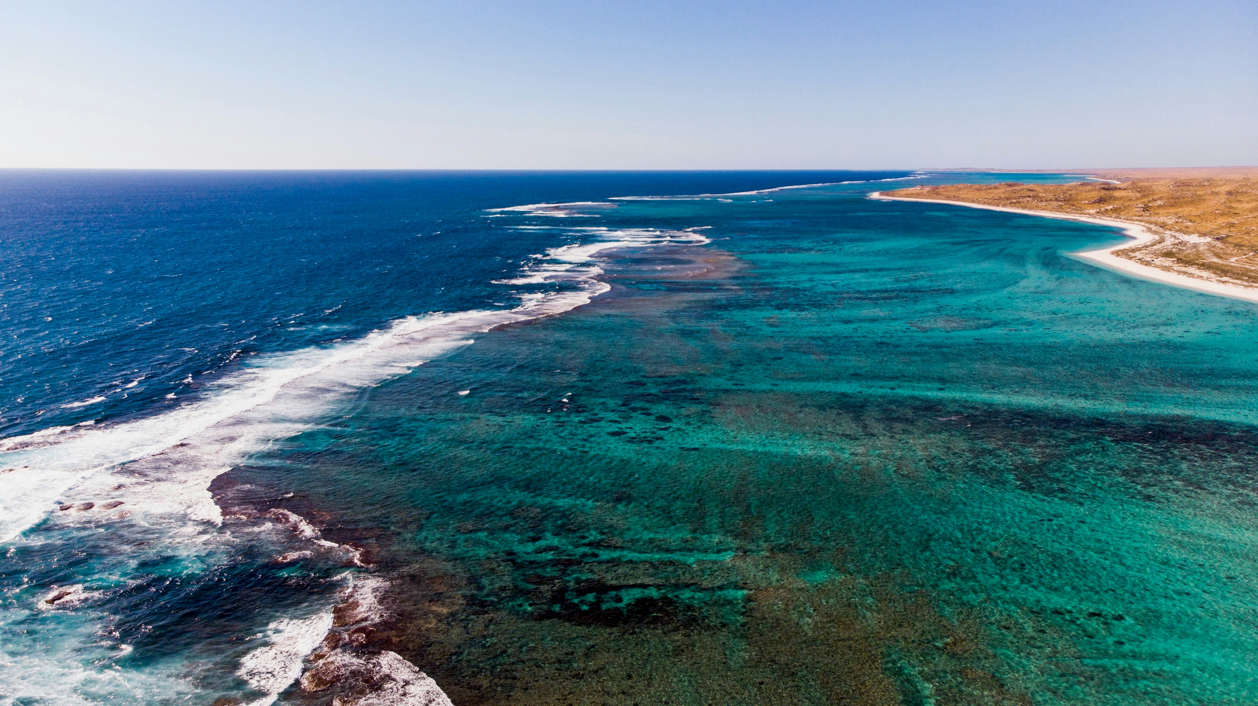 green and blue sea during daytime